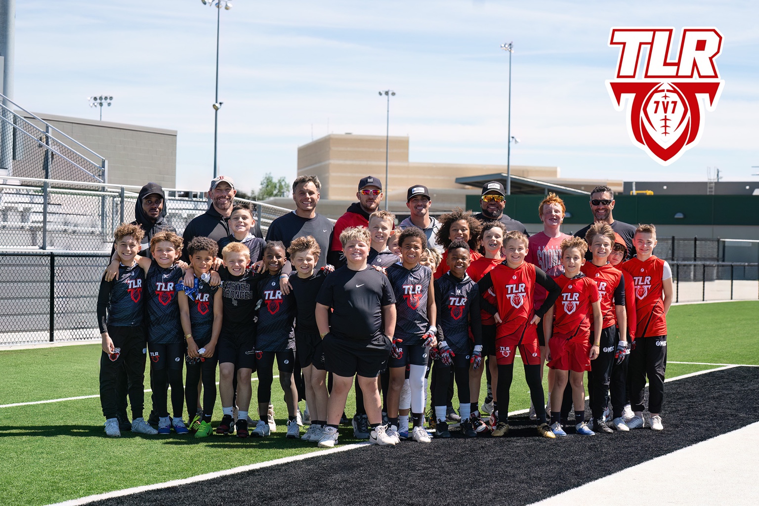 The Locker Room football teams and coaches together on the field