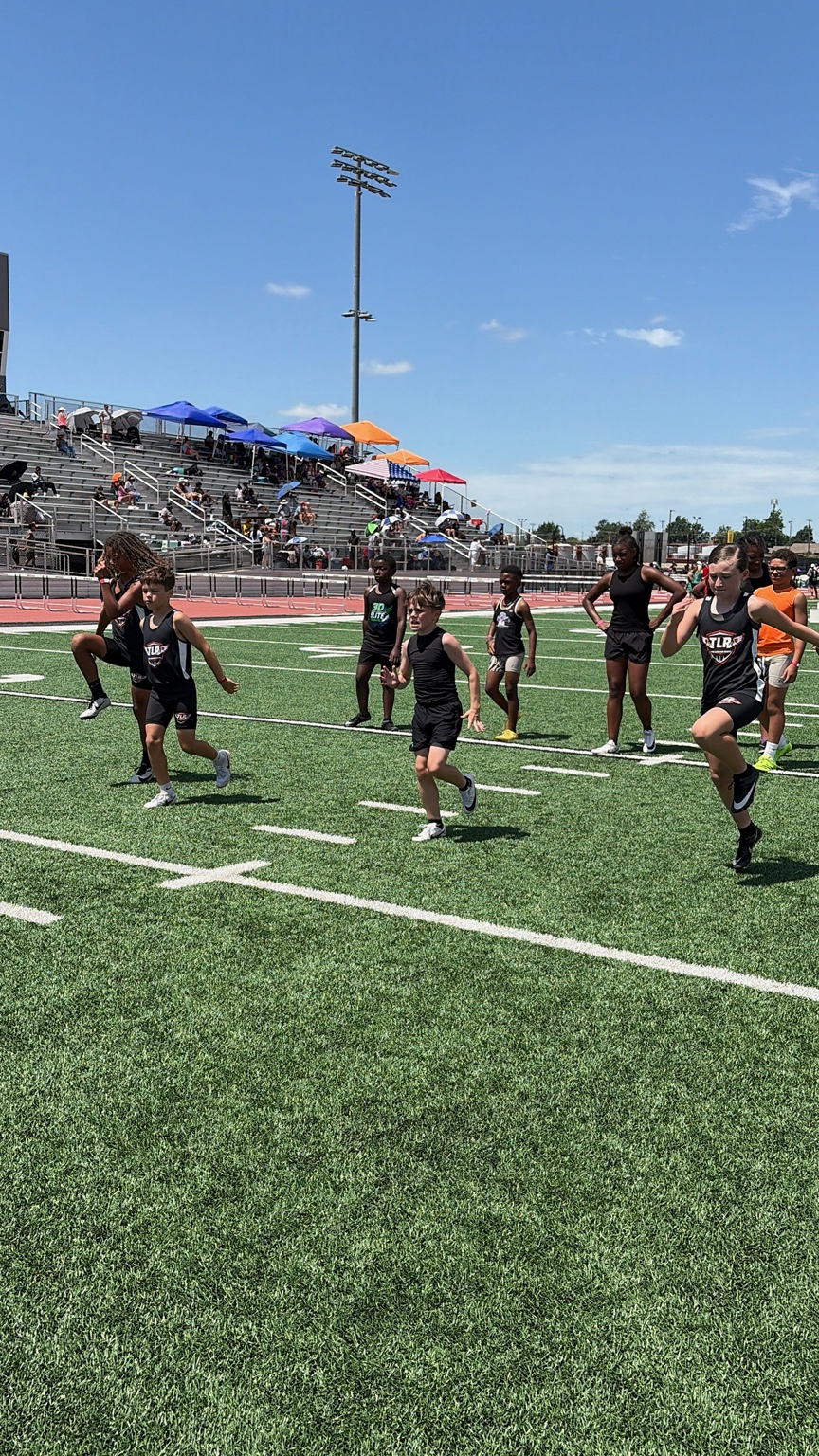 Athletes working through a team warmup